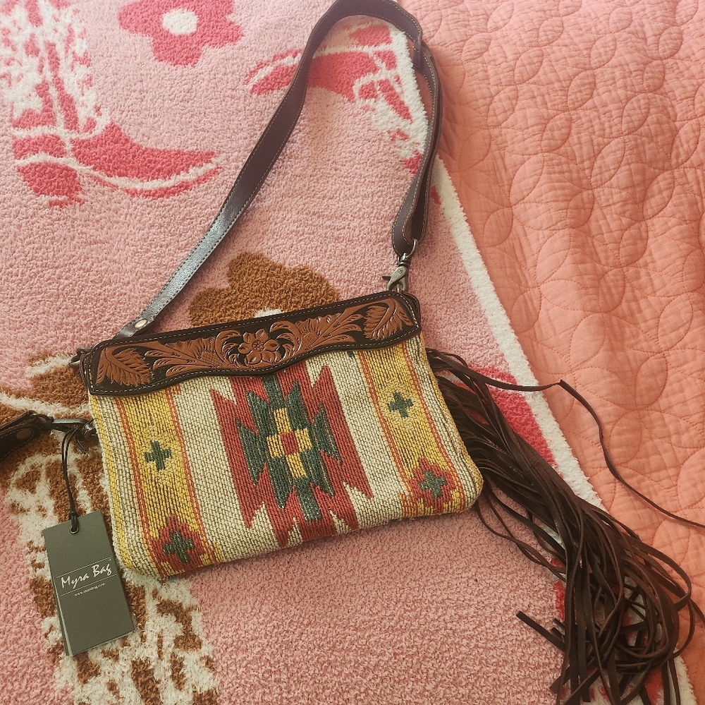 Myra crossbody or wristlet.